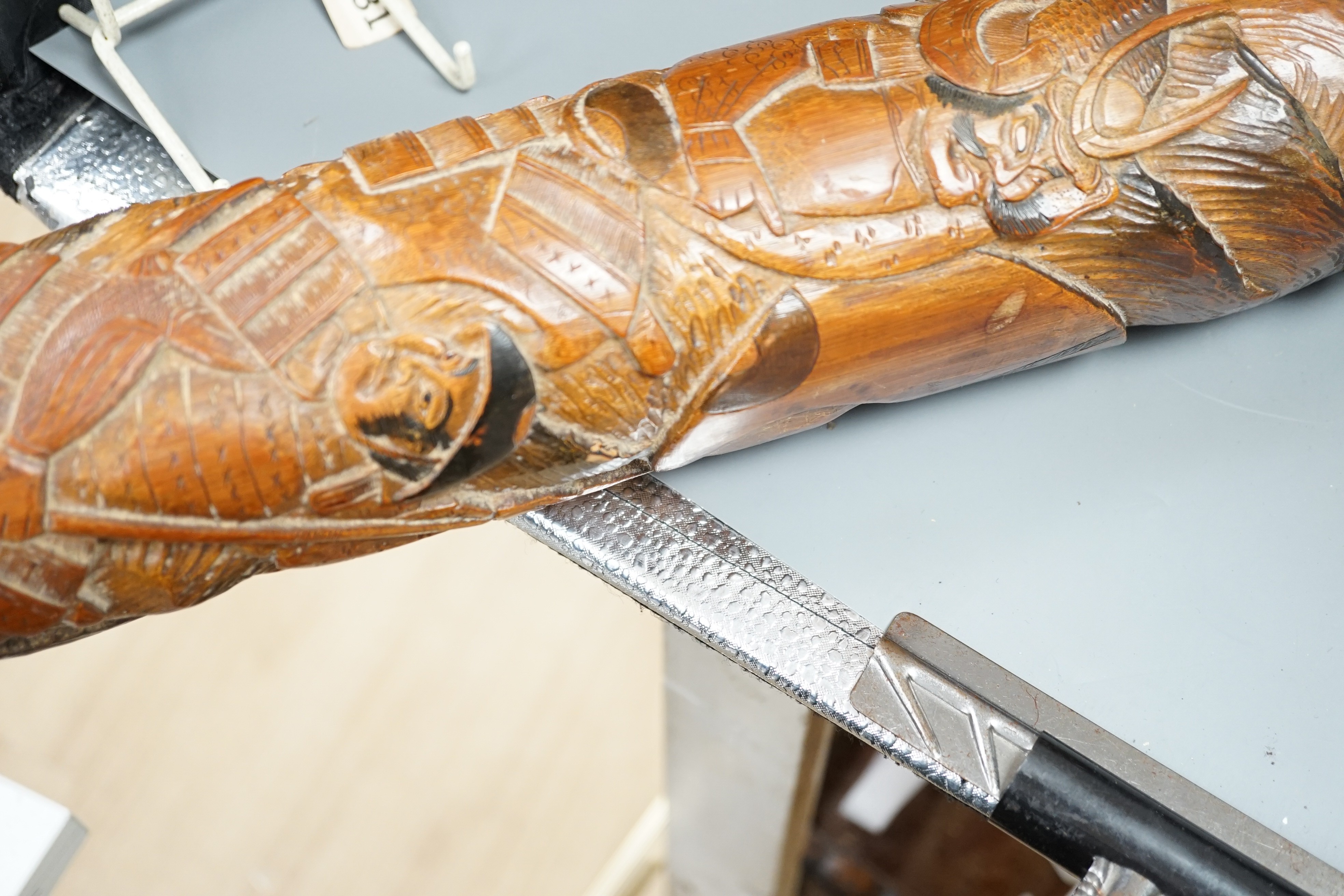 A large Japanese bamboo carving, Meiji period, possibly a drum beater, 105 cms long.